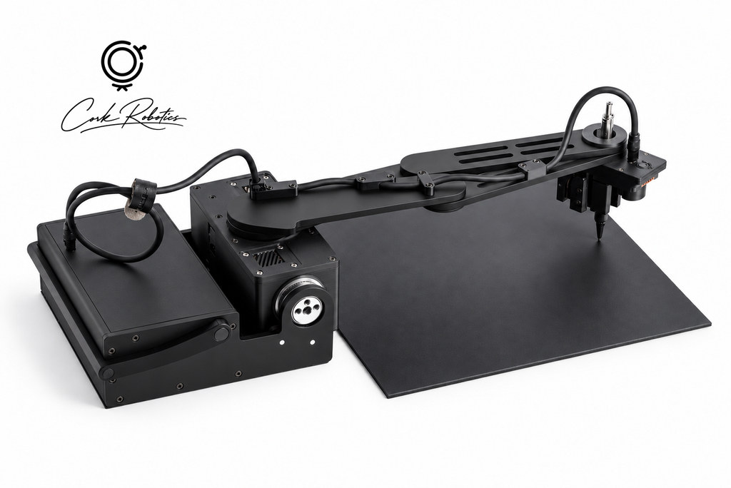 CorkBot with its drawing arm extended over a black work mat
